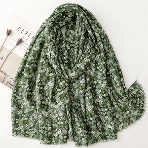 Floral cotton linen feel scarf with gold foil flower print on a deep green background