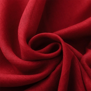 Solid deep red cotton linen scarf showing soft drape and natural plain weave texture