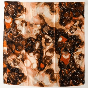 Detail view of square scarf with gold foil accents and abstract colorful rendering texture