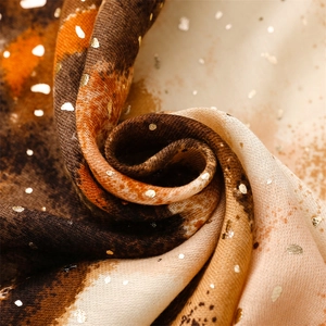 Detail of cotton-linen feel scarf featuring gold foil accents and colorful marble texture