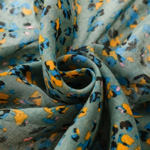 Macro detail of abstract floral pattern fabric with soft cotton linen texture