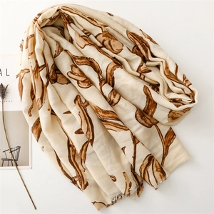 Detailed texture of cotton linen scarf with elegant brown floral print patterns