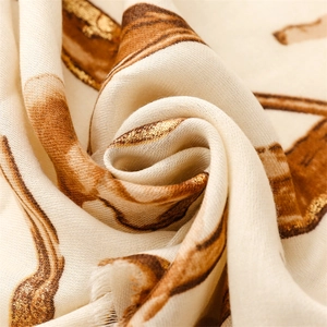 Detailed macro view of the soft cotton-linen fabric with gold leaf floral patterns