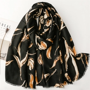 Elegant black cotton linen scarf with orange leaf pattern and fringe, stylish autumn shawl