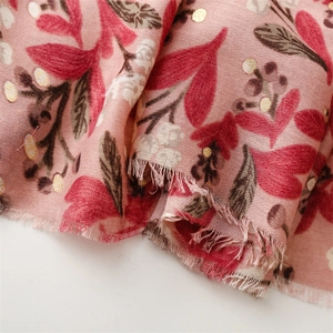 Detail of pink cotton-linen scarf with gold foil dots and botanical flower patterns