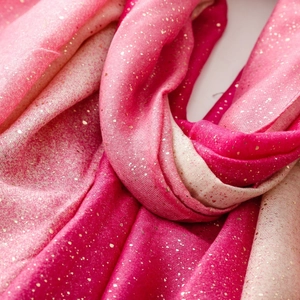 Detailed close-up of pink gradient cotton linen scarf with gold foil accents