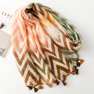 Close-up of lightweight cotton linen scarf with wave pattern and fringe detail