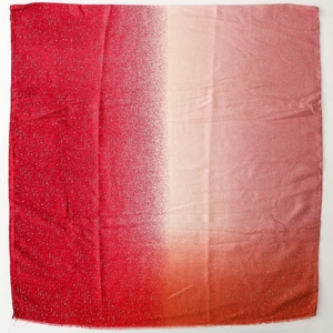 Detail of gradient red linen-feel scarf with sparkling silver foil polka dot patterns