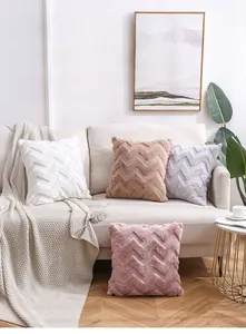 Detail of Nordic double-sided plush pillows with 3D herringbone texture on a sofa