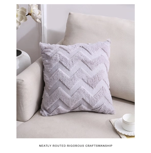 Detailed texture of lavender plush throw pillow with chevron pattern on a cozy sofa