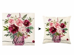 Detail of linen pillowcase featuring watercolor pink flowers and artistic bloom text
