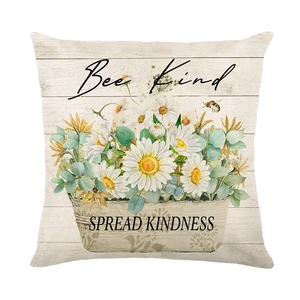 Floral Bee Kind pillow cover with white daisies and eucalyptus leaves on linen texture