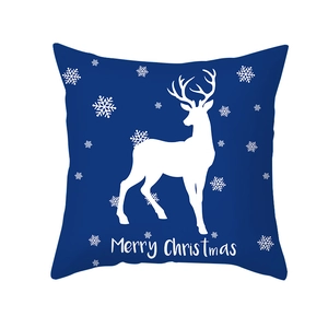 Housse de coussin de Noël bleue avec rennes blancs, flocons et texte de Joyeux Noël