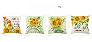 Detalle de cuatro fundas de cojín veraniegas con girasoles y estampados florales