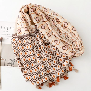 Detail of cotton linen scarf with geometric star moon print and colorful tassels