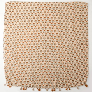 Close-up of floral print cotton linen scarf with handmade bohemian tassels and fringes