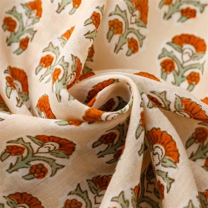 Close-up of linen floral scarf showing vintage flower prints and soft fabric texture