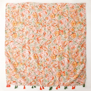 Lightweight floral print scarf with orange tassels and gold flower patterns