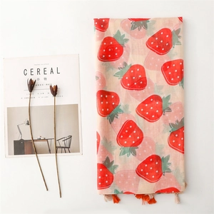 Light pink cotton-linen scarf featuring vibrant red strawberry prints and fringe trim