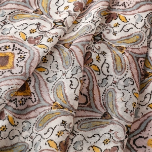 Close-up of lightweight paisley fabric with delicate vintage ethnic patterns and textures