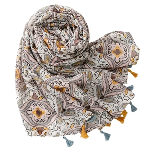 Bohemian paisley print shawl with tassels in beige and muted tones on white background