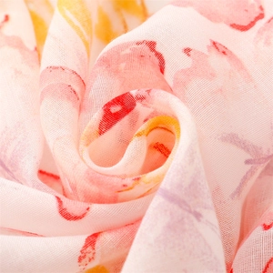 Macro detail of breathable watercolor floral summer scarf fabric with ink art patterns