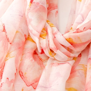 Detailed macro view of sheer floral printed scarf with delicate texture and soft patterns
