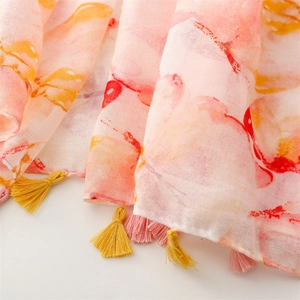Close-up of lightweight ink-wash floral scarf with dual-color fringe tassels