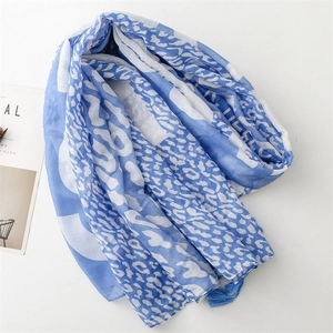 Blue leopard print cotton-linen shawl with tassels for sun protection and fashion styling