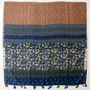 Bohemian paisley print shawl with geometric patterns and fringe for travel styling