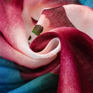 Close-up of lightweight ink-wash floral scarf with vibrant watercolor texture