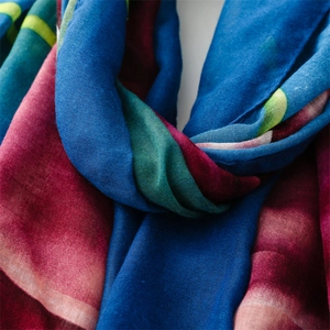 Close-up of artistic gradient stripes on a retro ink-wash style summer scarf wrap