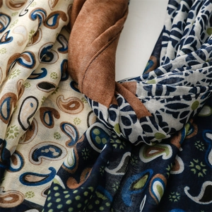Close-up of vintage paisley and geometric patterns on soft breathable fabric shawl