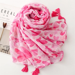 Pink heart print scarf with tassels made of breathable cotton and linen blend fabric