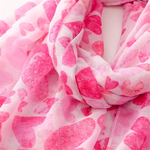 Close-up of pink heart print scarf showing soft cotton linen texture and detail