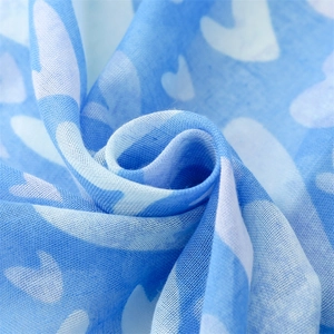 Macro detail of breathable cotton-linen texture blue heart print scarf fabric wrap