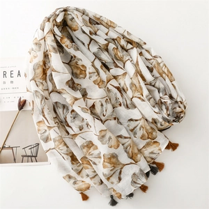 Vintage ginkgo leaf print scarf with tassels for sun protection and photography