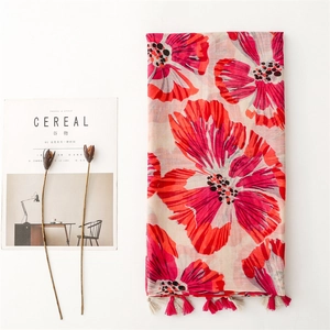 Lightweight voile scarf with red cymbidium flower print and fringe tassels