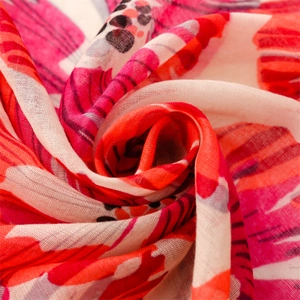 Close-up of lightweight red orchid floral scarf showing fine breathable fabric texture