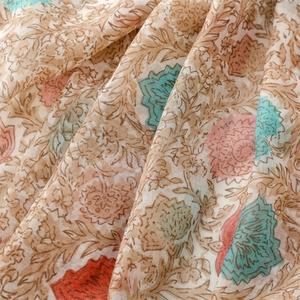 Detailed macro shot of vintage floral pattern on lightweight cotton sun protection shawl