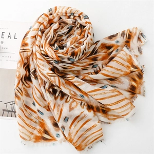 Detail of multi-color geometric cotton linen scarf with gold foil and frayed edges
