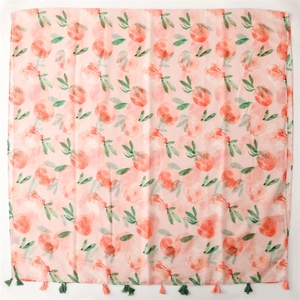 Pink cotton-linen scarf with watercolor peach prints and decorative tassels on white base