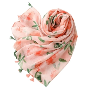 Peach print linen scarf with tassels displayed in a heart shape on white background