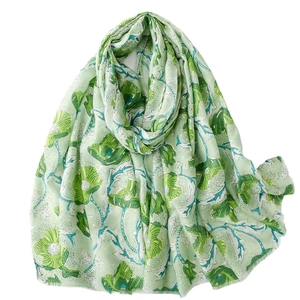 Bohemian light green cotton linen scarf with large floral print and frayed edges for women