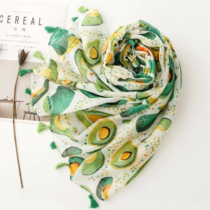 Detail shot of avocado print scarf with green tassels and light linen-feel texture