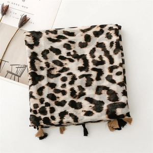 Detail of leopard print scarf featuring cotton-linen texture and stylish fringe tassels