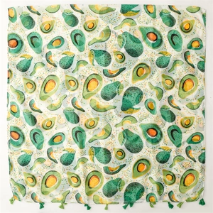 Linen feel scarf featuring cartoon avocado print and green tassel edges for sun protection