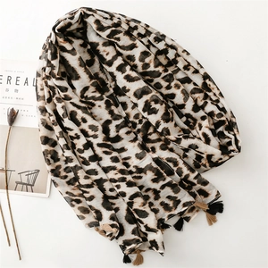 Leopard print cotton linen feel scarf shawl with fringe trim on white background