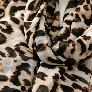 Macro detail of breathable cotton linen fabric with classic leopard print pattern
