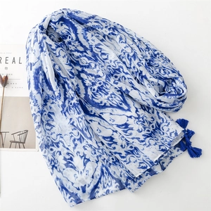 Blue floral linen-feel scarf with elegant tassels and white abstract tie-dye design